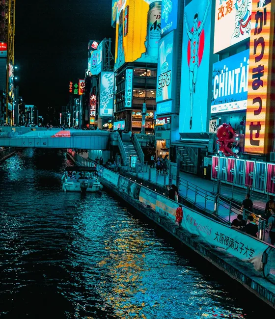 Neon signs at Dotonbori reflected in the canal at night